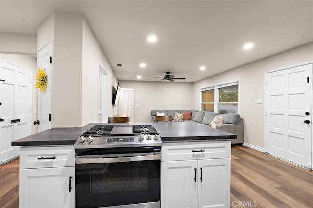 716 N Tulare Way, Upland, CA 91786 - kitchen featuring stainless steel range with gas stovetop, recessed lighting, ceiling fan, open floor plan, and light wood finished floors