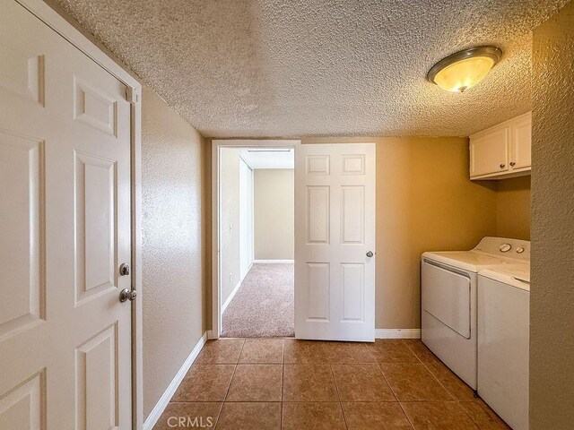 16702 Canoe Cv, Moreno Valley, CA 92551 - laundry room featuring cabinet space, separate washer and dryer, a textured ceiling, and tile patterned floors