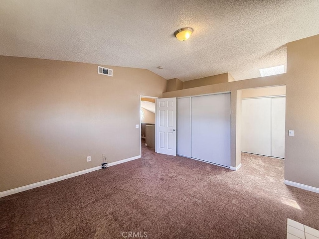 16702 Canoe Cv, Moreno Valley, CA 92551 - unfurnished bedroom with carpet flooring, lofted ceiling, and a textured ceiling