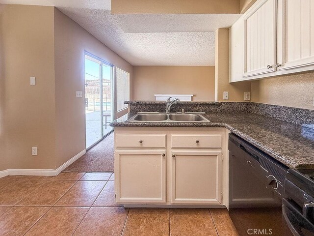 16702 Canoe Cv, Moreno Valley, CA 92551 - kitchen featuring a peninsula, dishwasher, a textured ceiling, light tile patterned floors, and white cabinets