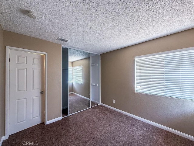 16702 Canoe Cv, Moreno Valley, CA 92551 - unfurnished bedroom featuring carpet, a textured ceiling, and a closet