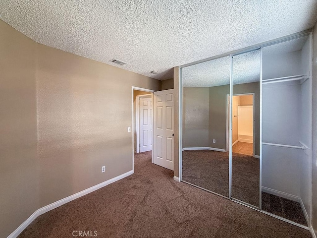 16702 Canoe Cv, Moreno Valley, CA 92551 - unfurnished bedroom with a closet, carpet flooring, and a textured ceiling
