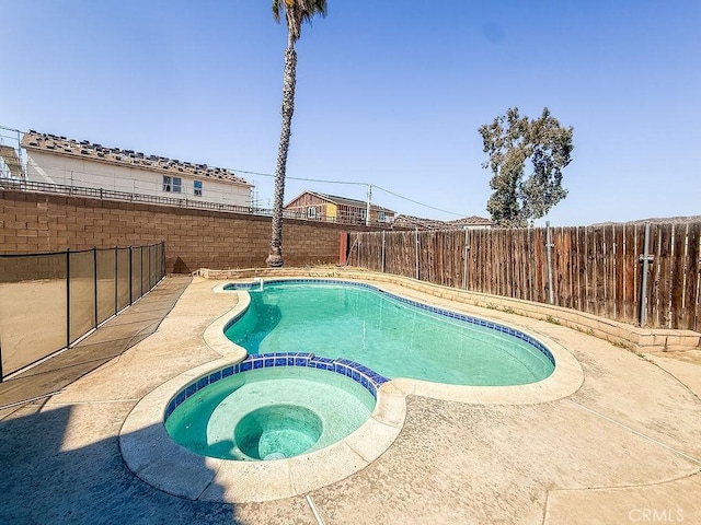 16702 Canoe Cv, Moreno Valley, CA 92551 - view of pool with a pool with connected hot tub and a fenced backyard