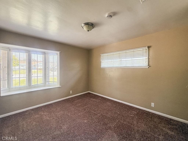 409 N Elwood Ave, Glendora, CA 91741 - empty room featuring dark colored carpet and a smoke detector
