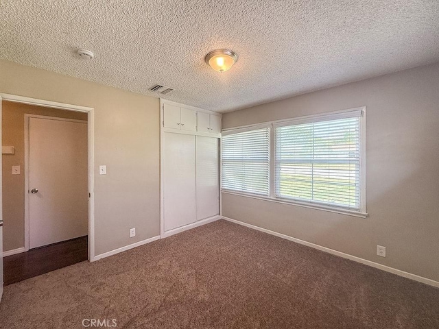 409 N Elwood Ave, Glendora, CA 91741 - unfurnished bedroom with carpet, a closet, and a textured ceiling
