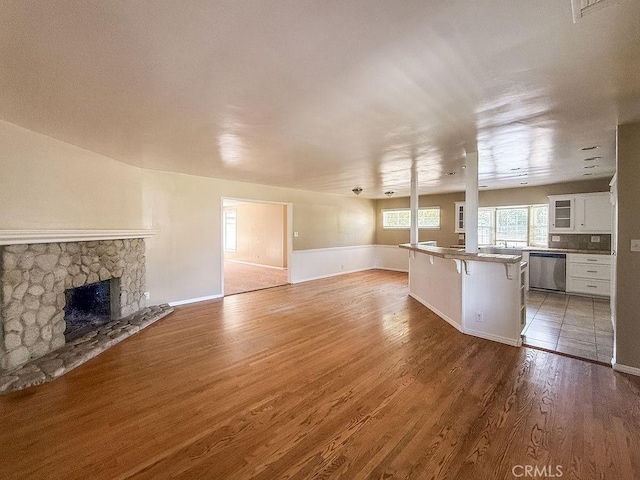 409 N Elwood Ave, Glendora, CA 91741 - unfurnished living room with light wood-type flooring and a fireplace