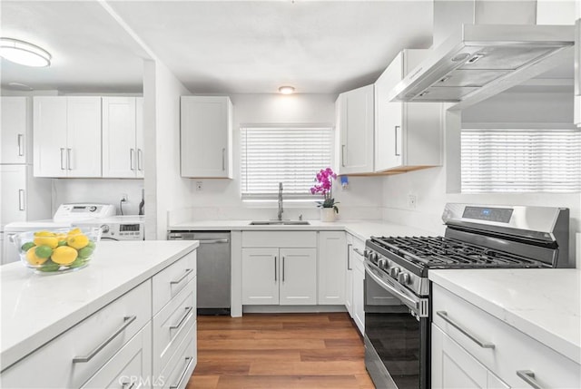 2027 W 70th St, Los Angeles, CA 90047 - kitchen featuring appliances with stainless steel finishes, range hood, wood finished floors, and white cabinets