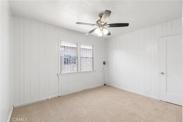 2027 W 70th St, Los Angeles, CA 90047 - carpeted spare room featuring a ceiling fan and baseboards