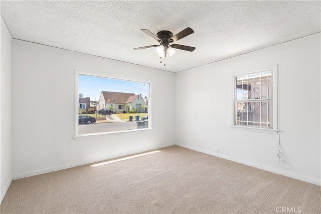 2027 W 70th St, Los Angeles, CA 90047 - carpeted empty room with ceiling fan and a textured ceiling