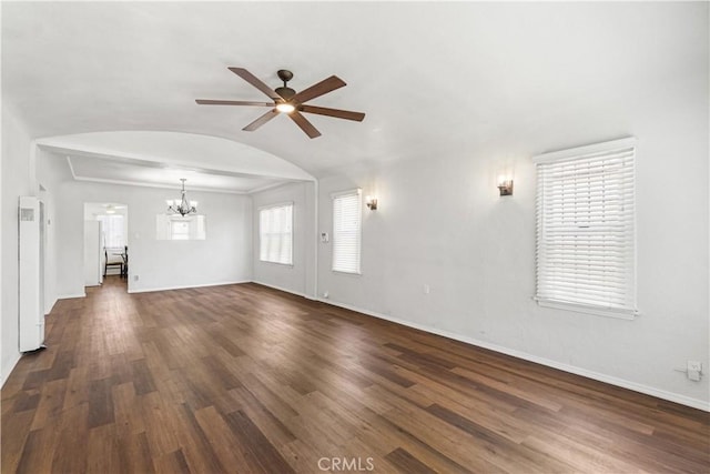 2027 W 70th St, Los Angeles, CA 90047 - unfurnished living room featuring a ceiling fan, a chandelier, lofted ceiling, dark wood-style floors, and arched walkways
