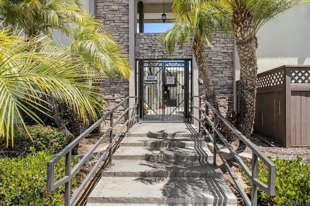 6602 Beadnell Way Unit 10, San Diego, CA 92117 - entrance to property featuring a gate and stone siding