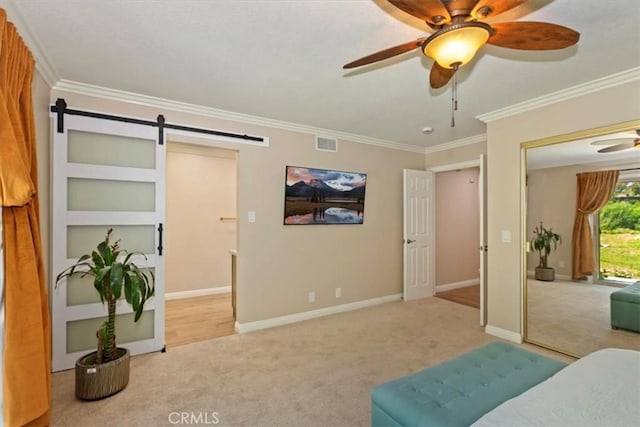 2287 Kemper Ave, Claremont, CA 91711 - carpeted bedroom with a barn door, ornamental molding, and a ceiling fan