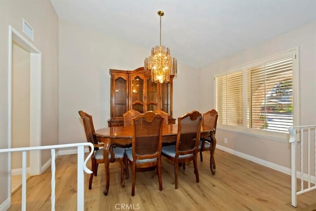 2287 Kemper Ave, Claremont, CA 91711 - dining room featuring a chandelier, light wood-type flooring, and lofted ceiling