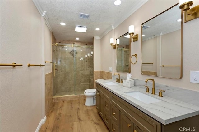 2287 Kemper Ave, Claremont, CA 91711 - full bath featuring wood finished floors, double vanity, a shower stall, recessed lighting, and a textured ceiling