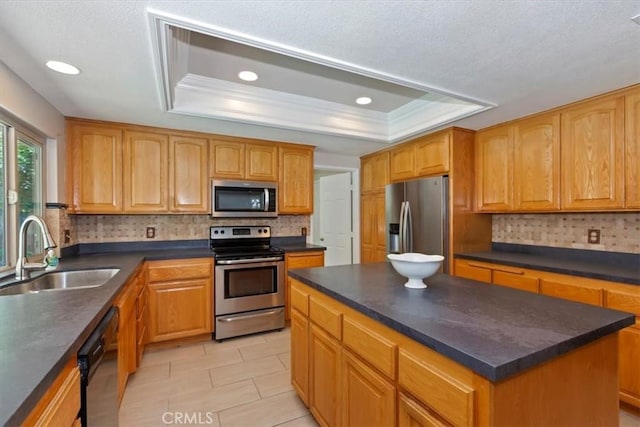 2287 Kemper Ave, Claremont, CA 91711 - kitchen with stainless steel appliances, a tray ceiling, dark countertops, backsplash, and a center island