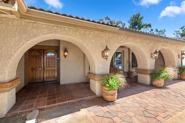 2287 Kemper Ave, Claremont, CA 91711 - view of exterior entry featuring stucco siding and a patio