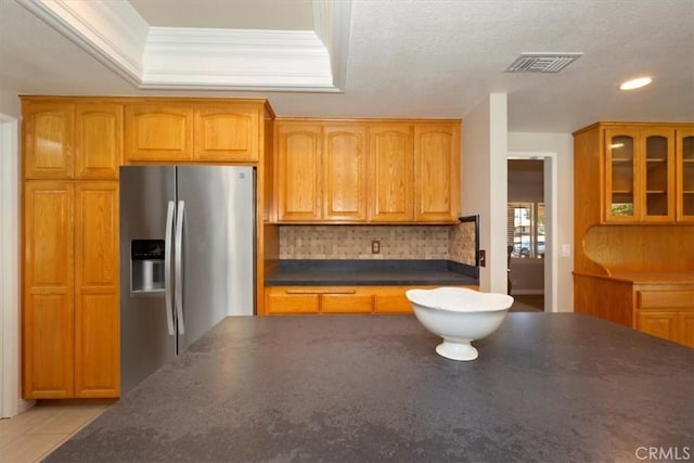 2287 Kemper Ave, Claremont, CA 91711 - kitchen with stainless steel fridge with ice dispenser, dark countertops, tasteful backsplash, glass insert cabinets, and recessed lighting