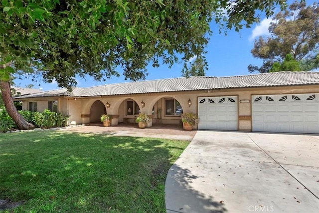 2287 Kemper Ave, Claremont, CA 91711 - view of front facade with driveway, an attached garage, a front lawn, and stucco siding