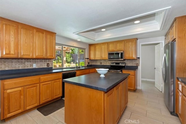 2287 Kemper Ave, Claremont, CA 91711 - kitchen featuring stainless steel appliances, a raised ceiling, decorative backsplash, dark countertops, and recessed lighting