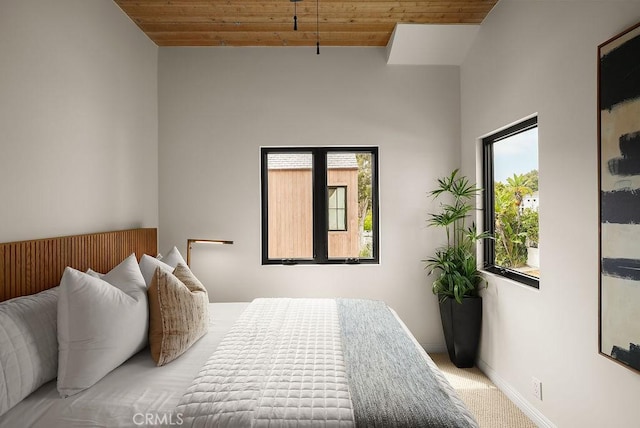 4411/2 Goldenrod Ave, Corona Del Mar, CA 92625 - carpeted bedroom with wood ceiling, multiple windows, and lofted ceiling