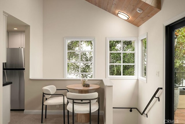 4411/2 Goldenrod Ave, Corona Del Mar, CA 92625 - dining space with lofted ceiling, plenty of natural light, light tile patterned floors, and wood ceiling