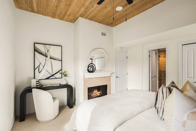 4411/2 Goldenrod Ave, Corona Del Mar, CA 92625 - bedroom with carpet, wood ceiling, and a lit fireplace