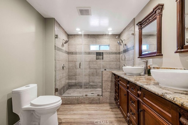 700 E Washington St Unit 143, Colton, CA 92324 - full bathroom with a shower stall, double vanity, wood finished floors, and recessed lighting