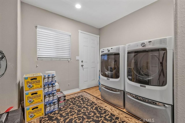 700 E Washington St Unit 143, Colton, CA 92324 - washroom with wood finished floors and separate washer and dryer