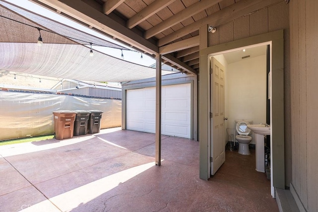 700 E Washington St Unit 143, Colton, CA 92324 - garage with wooden ceiling