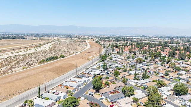 700 E Washington St Unit 143, Colton, CA 92324 - aerial view of property's location with a mountain backdrop and nearby suburban area