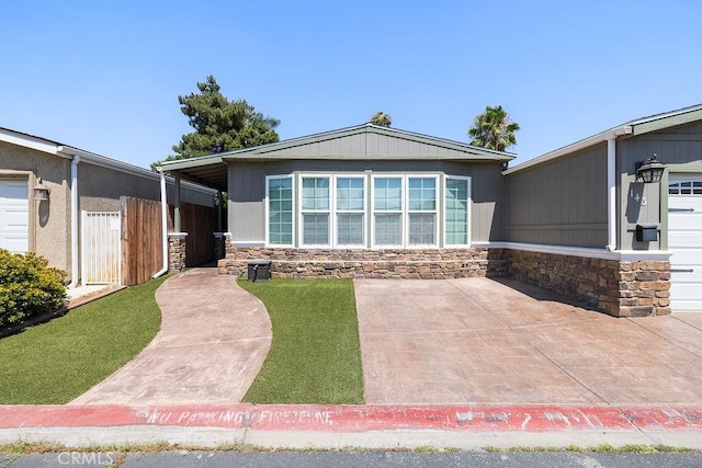 700 E Washington St Unit 143, Colton, CA 92324 - view of front facade with stone siding and a patio