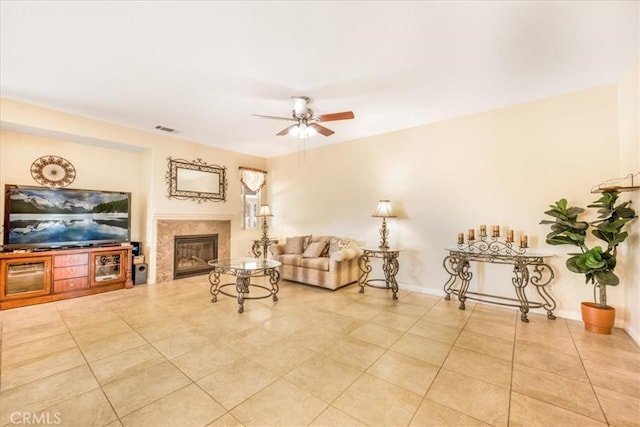 19247 Mountain Shadow Ln, Perris, CA 92570 - tiled living room featuring ceiling fan and a glass covered fireplace