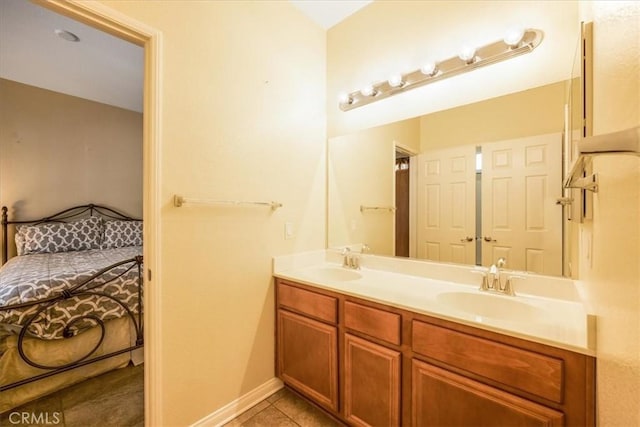 19247 Mountain Shadow Ln, Perris, CA 92570 - ensuite bathroom featuring double vanity and tile patterned floors