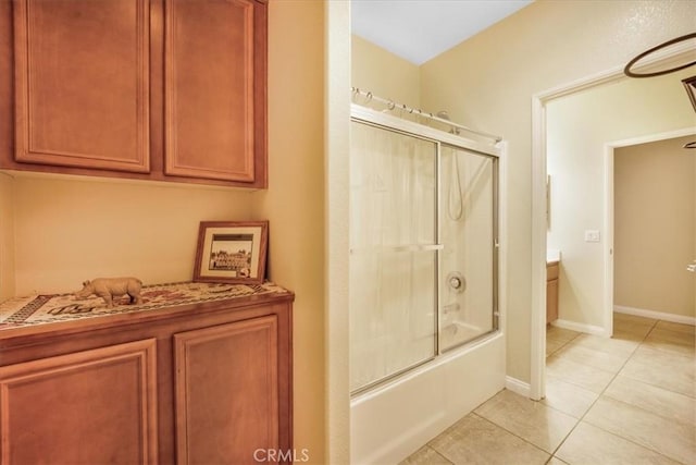 19247 Mountain Shadow Ln, Perris, CA 92570 - bathroom with tile patterned floors, bath / shower combo with glass door, and vanity