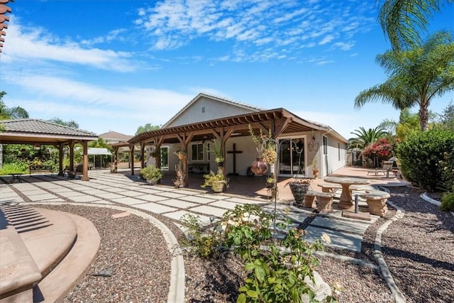 19247 Mountain Shadow Ln, Perris, CA 92570 - rear view of house with a patio area, a gazebo, stucco siding, and a pergola