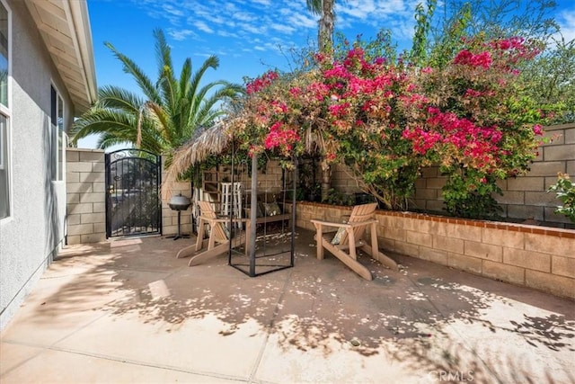 19247 Mountain Shadow Ln, Perris, CA 92570 - fenced backyard featuring a gate and a patio area