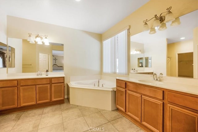 19247 Mountain Shadow Ln, Perris, CA 92570 - bathroom featuring a bath, two vanities, tile patterned flooring, and a closet