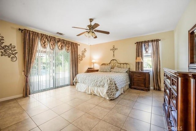 19247 Mountain Shadow Ln, Perris, CA 92570 - bedroom with access to exterior, light tile patterned floors, and a ceiling fan