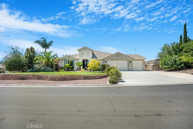 19247 Mountain Shadow Ln, Perris, CA 92570 - mediterranean / spanish house featuring an attached garage and concrete driveway