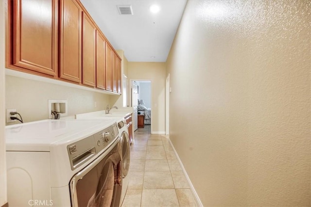 19247 Mountain Shadow Ln, Perris, CA 92570 - laundry room with washing machine and dryer, cabinet space, and light tile patterned floors