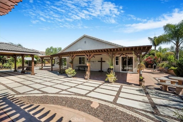 19247 Mountain Shadow Ln, Perris, CA 92570 - rear view of house with a patio area, a pergola, stucco siding, and a gazebo