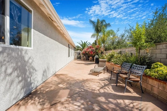 19247 Mountain Shadow Ln, Perris, CA 92570 - fenced backyard featuring a patio area