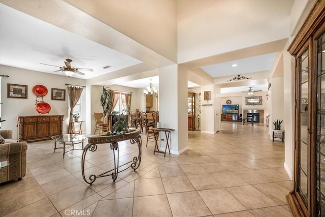 19247 Mountain Shadow Ln, Perris, CA 92570 - living room featuring ceiling fan, light tile patterned flooring, and a chandelier