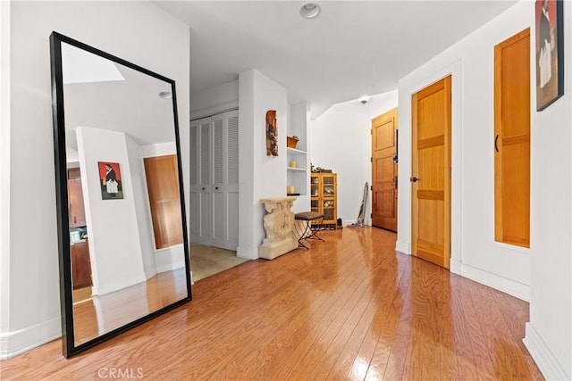 411 N Oakhurst Dr Unit 201, Beverly Hills, CA 90210 - corridor featuring light wood-style floors and built in features