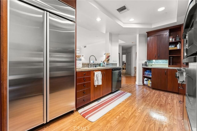 411 N Oakhurst Dr Unit 201, Beverly Hills, CA 90210 - kitchen with appliances with stainless steel finishes, open shelves, light wood-style floors, light countertops, and recessed lighting