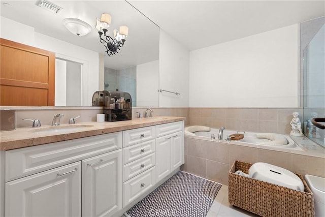 411 N Oakhurst Dr Unit 201, Beverly Hills, CA 90210 - bathroom featuring double vanity, a garden tub, tile patterned flooring, and tiled shower