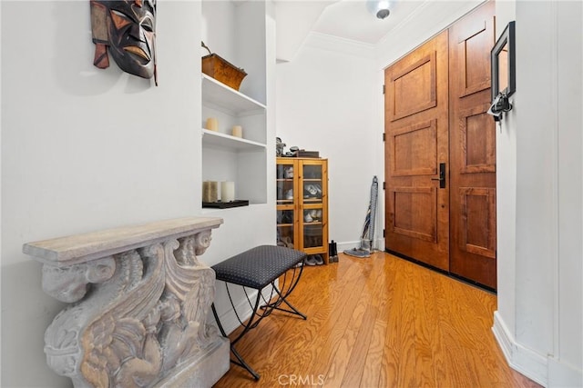 411 N Oakhurst Dr Unit 201, Beverly Hills, CA 90210 - foyer with light wood finished floors and crown molding