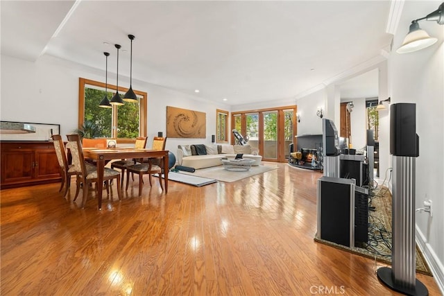 411 N Oakhurst Dr Unit 201, Beverly Hills, CA 90210 - living room featuring light wood-style flooring, plenty of natural light, and ornamental molding