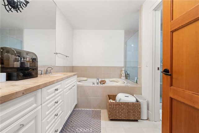 411 N Oakhurst Dr Unit 201, Beverly Hills, CA 90210 - full bathroom featuring vanity, tile patterned flooring, and a garden tub