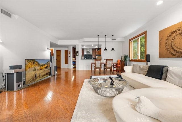 411 N Oakhurst Dr Unit 201, Beverly Hills, CA 90210 - living room featuring light wood finished floors, recessed lighting, and ornamental molding